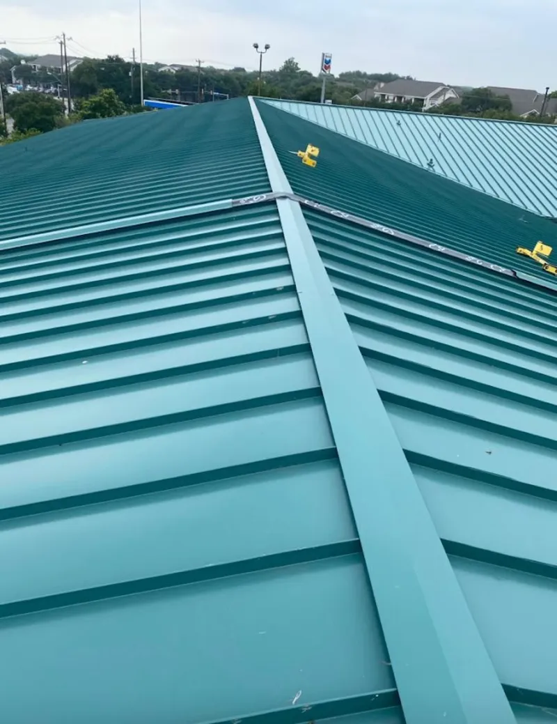 Green commercial metal roof ridge and valley for Metal Roof Repair in Loughman